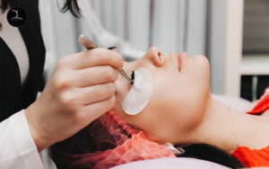 Dreamlash technician performing a professional eyelash extension procedure for beginners.